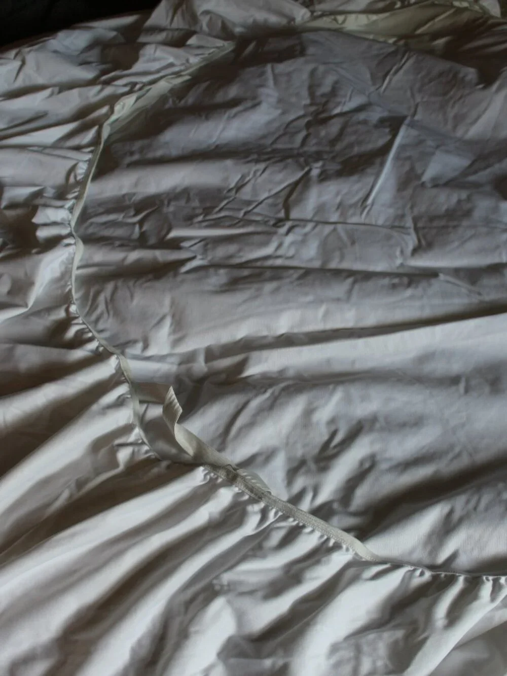 White fitted mattress protectors in a twin size